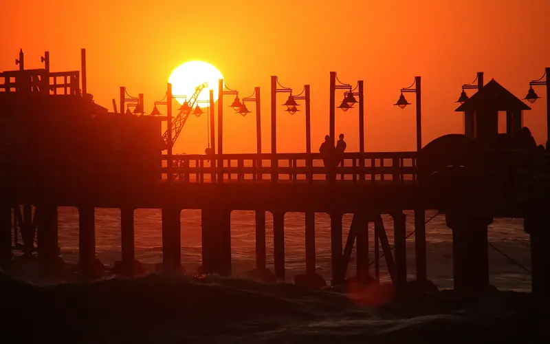 Swakopmund jetty silhouetted against the sunset over the Atlantic