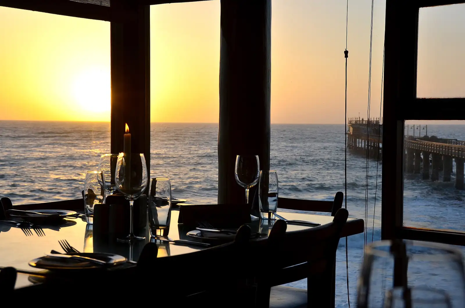 Sunset over the Atlantic seen from the restaurant on the Swakopmund jetty