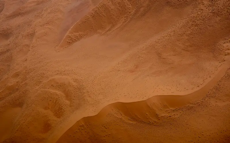 Aerial view of rippling dune ridges in the Namib Desert