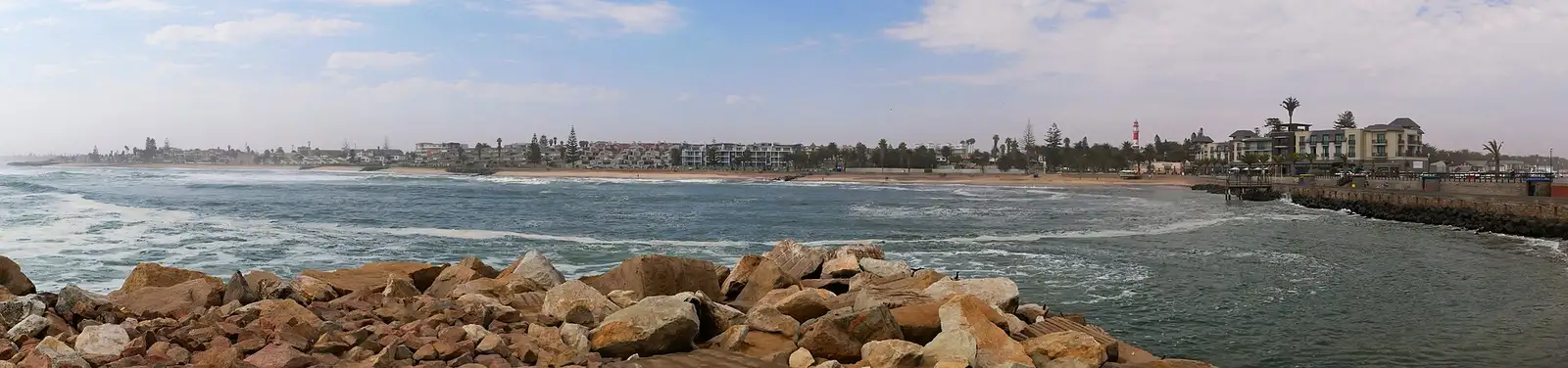 Swakopmund skyline seen across the water from the rocks of the Mole