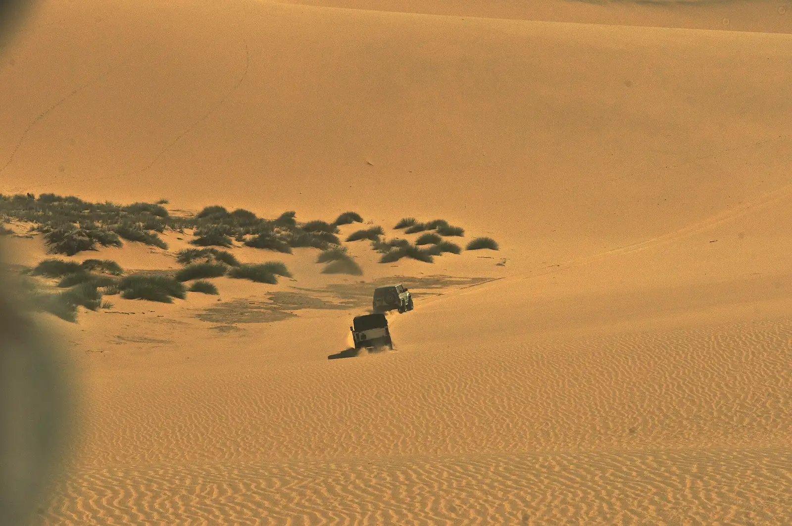 Tall dunes running straight into the Atlantic Ocean at Sandwich Harbour, south of Walvis Bay