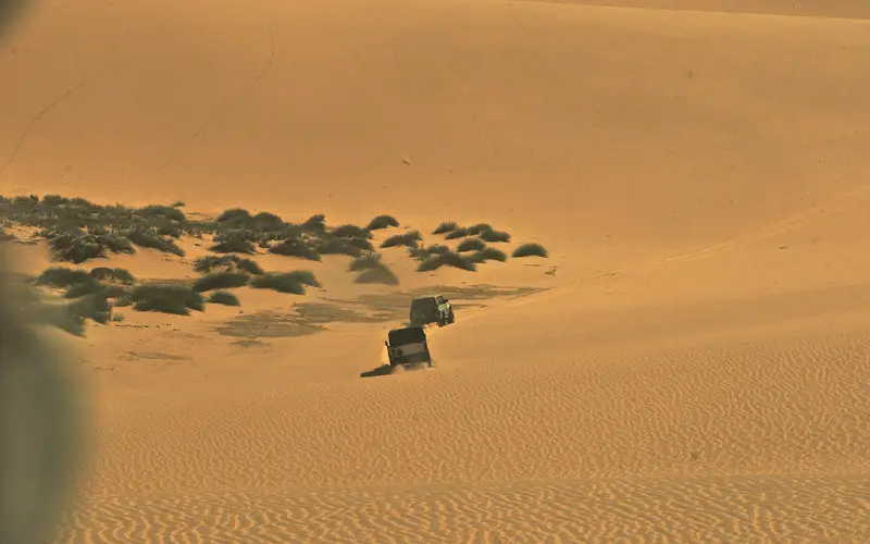 Tall dunes running straight into the Atlantic Ocean at Sandwich Harbour, south of Walvis Bay