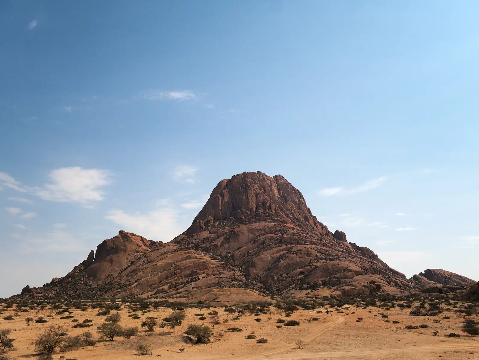 The granite peak of Spitzkoppe rising above the flat Namib plains
