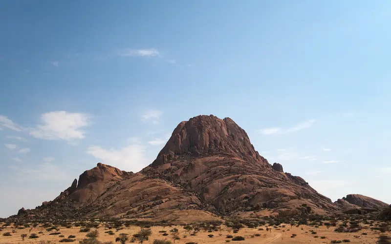 The granite peak of Spitzkoppe rising above the flat Namib plains