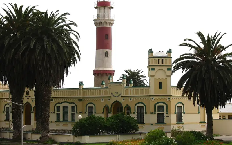 Swakopmund's lighthouse beside the former imperial district court, now the State House